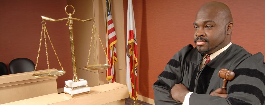 Photo of judge with arms folded