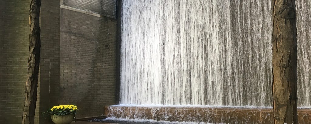 photo of urban park with waterfall
