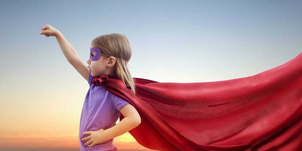Photo of a little girl playing superhero. Be your own superhero.